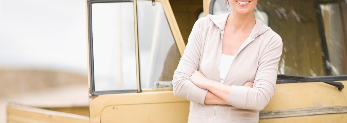 Woman leaning on a piaggio ape Woman leaning on a piaggio ape